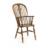 An ash and elm Windsor armchair on turned supports