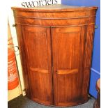 A 19th century mahogany inlaid bow front hanging corner cupboard, 75cm wide, 110cm high