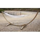 An Amazonas hammock on bow shaped stand, approx 370cm long