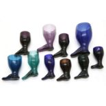 A collection of coloured glass boot form stirrup cups,