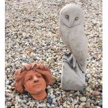 A life size cast stone sculpture of a barn owl, 41 cm high, together with an art nouveau wall