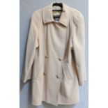 An Aquascutum mackintosh trench coat, and another similar in a light green colour, and two