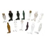 A collection of glass boot form scent bottles,