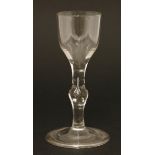 A George III wine glass with a round funnel bowl