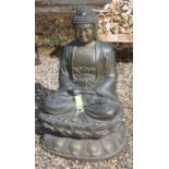 A bronze statue modelled as a seated Buddha on a lotus leaf base, 60cm wide, 60cm deep, 100cm high