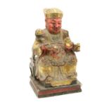 A Chinese polychrome decorated carved wooden figure