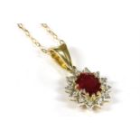 A 9 carat gold ruby and diamond cluster pendant