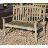 Two teak slatted garden benches,