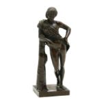 A bronze youth leaning on a post, (arm broken) 18cm high