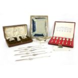 A silver cased condiment set,