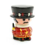 A ceramic moneybox in the shape of a Yeoman of the Guard, British c.1960, 18cm high