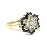 A 9ct gold diamond and sapphire cluster ring