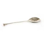A silver seal top spoon