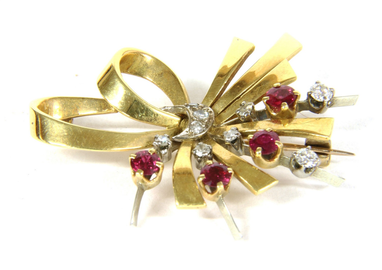 a gold ruby and diamond brooch