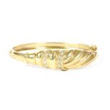 A 9ct gold diamond hinge bangle