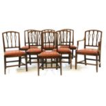 A set of eight George III mahogany dining chairs