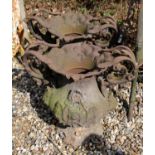 A pair of cast iron garden twin handled urns of baluster form with cartouche centres in relief