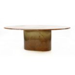 A large oval centre table, on an oval plinth, 142cm wide, 212cm long, 73cm high