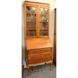 An Edwardian bureau bookcase