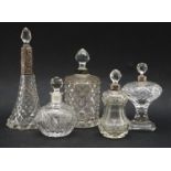 Seventeen cut glass scent bottles and jars, some wall silver mounts, tallest 21cm