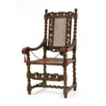 A William and Mary walnut cane armchair
