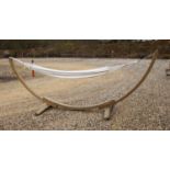 An Amazonas hammock on bow shaped stand, approx 370cm long