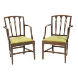 A pair of hepplewhite mahogany dining chairs with splat backs over open arms, 61 x 45 x 95 cm