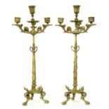 A pair of gilt brass four light candelabra