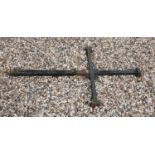 A large solid cast iron cross, 180 high x 96 wide