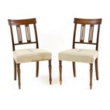 A pair of mahogany bar backed dining chairs,