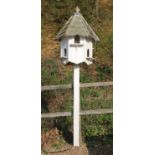 A white painted dovecote by Forsham Cottage Arks