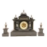 A Victorian slate architectural clock garniture