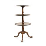 A George III mahogany three tier dumb waiter