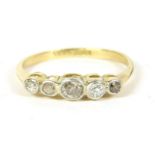 A gold five stone diamond ring