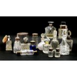 Sixteen various cut glass scent bottles and jars , some with silver mounts, tallest 12 cm