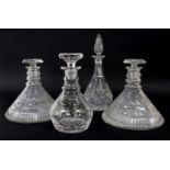 A pair of cut glass ships' decanters, and two others