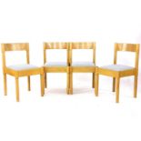 A set of four beech dining chairs