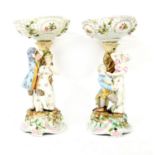 A pair of German porcelain centrepieces,