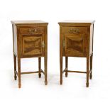 A pair of Edwardian walnut bedside cabinets