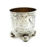 A Scandinavian silver beaker, having engraved foliate decoration and raised on three ball feet