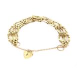 A 9ct gold four bar gate link bracelet