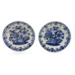 Two Delftware blue and white chargers. 34cm diam.