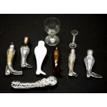 A collection of glass boot form scent bottles,