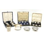 A collection of silver items, to include two pierced bon bon dishes, a bowl, three cased sets of