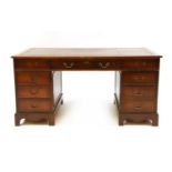 A mahogany pedestal desk