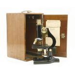 A cased Charles Perry microscope,