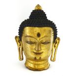 A Chinese gilt bronze head of Buddha