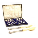 A set of twelve silver teaspoons and tongs