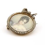 A fancy silver gild painted miniature brooch,