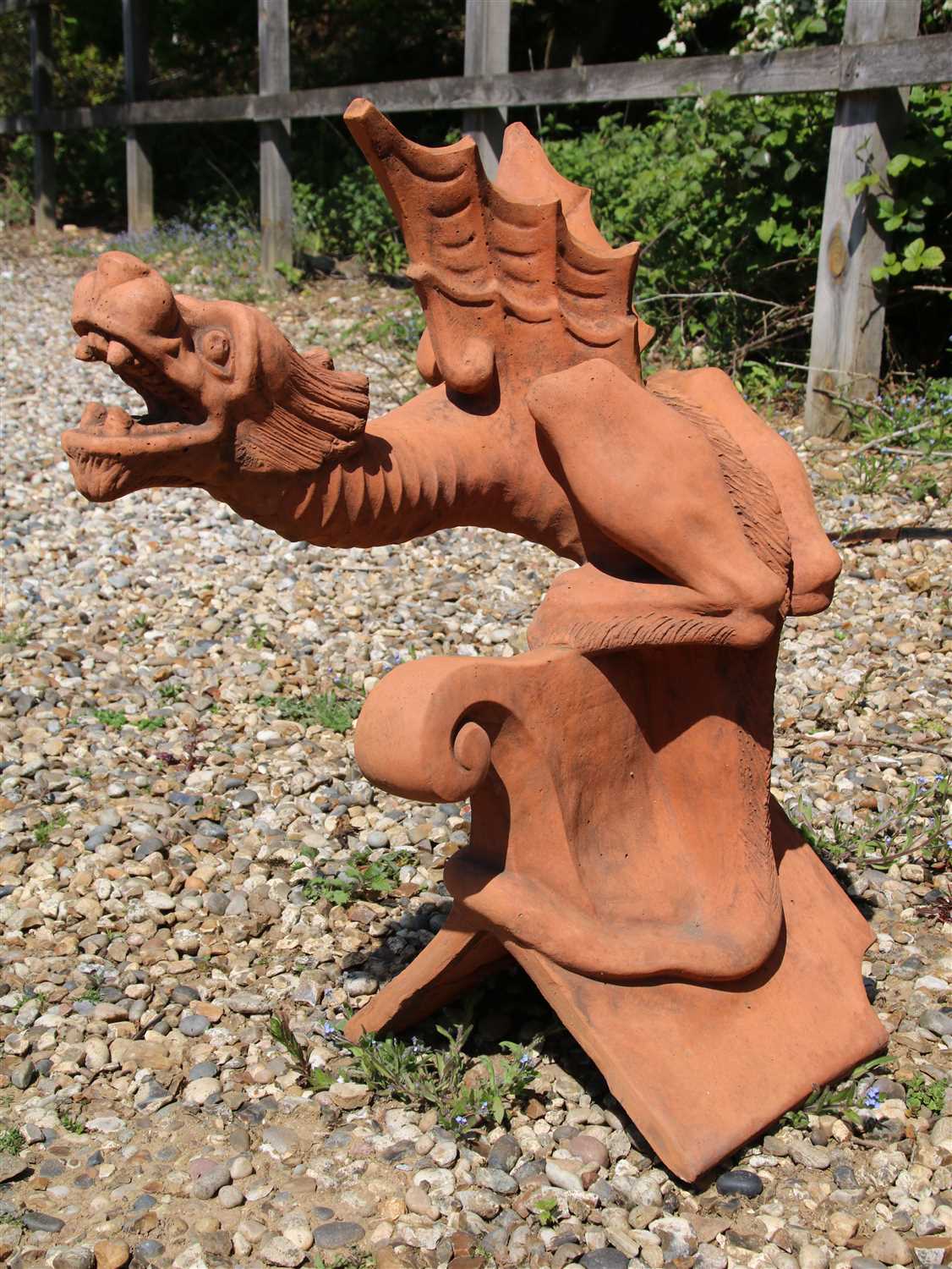 A terracotta roof ridge tile finial